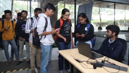 Students arriving at a House of Wise event and checking in